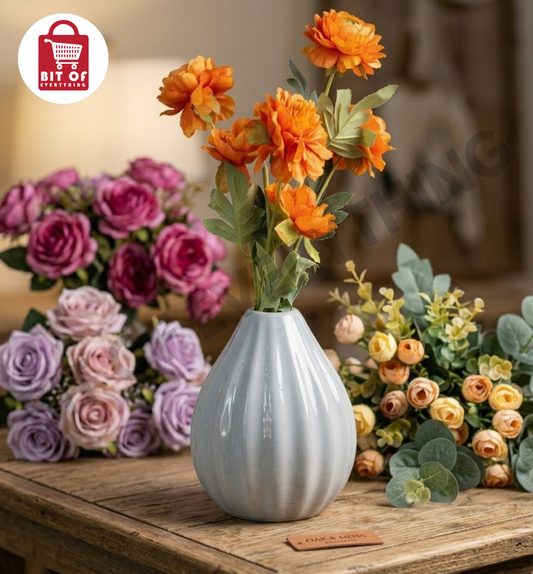 Ribbed Grey Ceramic Vase with Orange Marigolds and Ranunculi Flowers